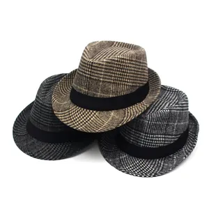 Three classic plaid fedora hats for men in brown, grey, and black with wide black bands
