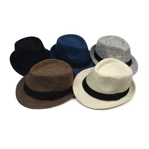 Close-up of woven fedora hats in various colors with elegant black ribbon bands
