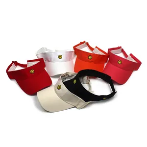 Detail of sun visor hats in six colors featuring embroidered yellow smiley face patches
