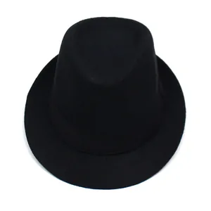 Detail of black woven fedora hat featuring a narrow brim and matching decorative band