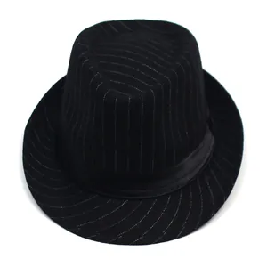 Top view of a black fedora hat with white stripes and a matching satin decorative ribbon