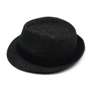 Top view showing textured weave texture and black grosgrain ribbon on the fedora hat