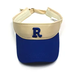 Detail of cotton sun visor hat featuring blue embroidered letter R and contrast stitching