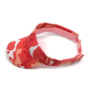Detail of red camouflage visor with adjustable strap and durable stitched canvas fabric
