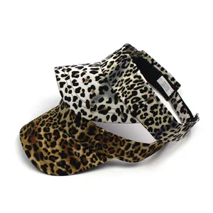 Detail of leopard print sun visors showing 100% polyester fabric texture and patterns