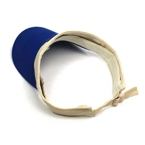 Detail view of cotton sun visor hat with blue brim and beige strap for sports