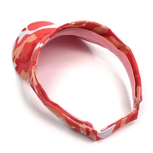 Detail of adjustable velcro closure on pink camouflage pattern sun visor hat