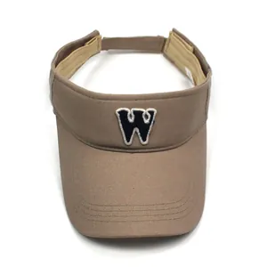 Detail showing embroidered letter W on breathable cotton open top khaki sun visor hat