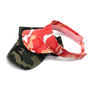 Detail view of two adjustable camouflage visor hats in green and multicolor patterns