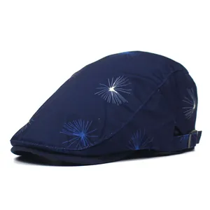 Navy blue cotton flat cap featuring dandelion starburst print with adjustable metal buckle