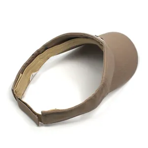 Detail view of brown cotton sun visor showing the adjustable hook and loop strap and sweatband