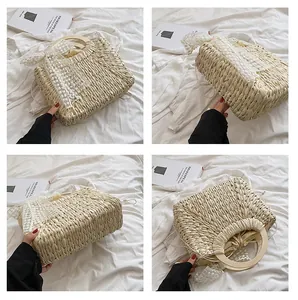 Detail of straw woven bag showing wooden ring handle, white lace scarf, and drawstring liner