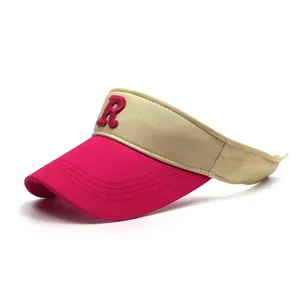 Detail view of cotton sun visor with pink brim and 3D embroidered letter R logo