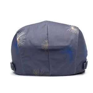 Detail view of cotton flat cap featuring dandelion print and adjustable metal side buckle