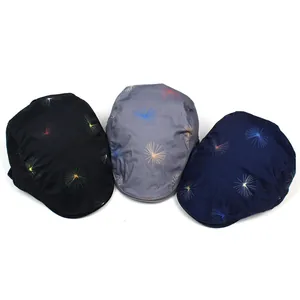 Three cotton beret caps with dandelion prints in black, grey and navy blue colors