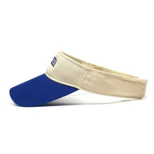 Detail of navy and beige cotton sun visor with high-quality blue letter embroidery