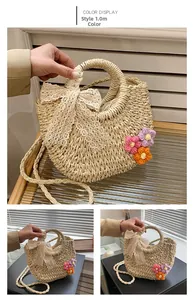 Detail of beige straw bag featuring a lace bow, crochet flowers, and woven texture