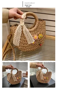 Detail of khaki straw handbag featuring handmade crochet flowers and lace ribbon accent