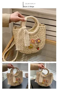 Detail of beige straw handbag with colorful woven flowers, ladybug, and lace ribbon