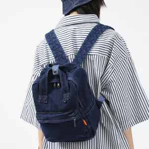 Dunkelblauer Denim-Rucksack für Damen mit Reißverschlussfach vorne im Freizeitstil