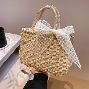 Sac à main en paille tressée avec nœud en dentelle marguerite et bandoulière chic