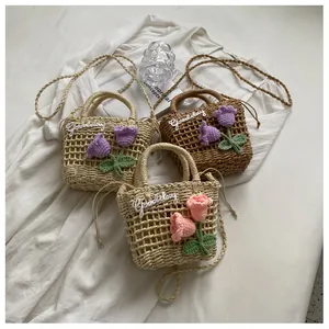 Detail of hand-woven straw bag with 3D crochet tulips and Goodday embroidery