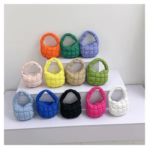 Detailed view of cloud quilted handbags in 12 vibrant macaron colors with square patterns