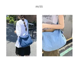 Dual view of large denim messenger bags in dark and light blue for casual outdoor use