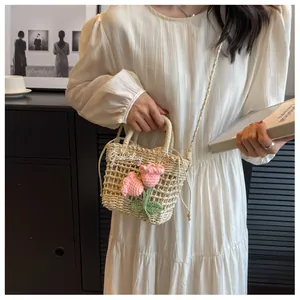 Detail of hand-woven straw bag featuring pink crochet tulips and a Goodday tag