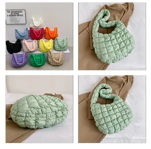 Detailed close-up of colorful quilted puffer tote bags in soft bubble textured fabric