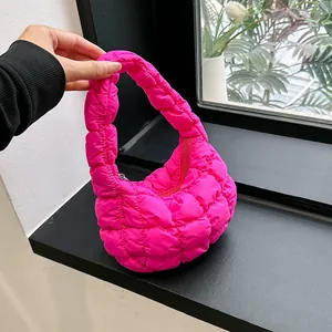 Hot pink quilted bubble tote bag with a cloud puff design and top zipper closure