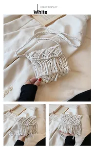 Close-up of white handmade woven cotton shoulder bag with bohemian fringe and hollow texture