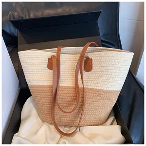 Detail of handwoven tote bag with leather straps in a premium gift box presentation