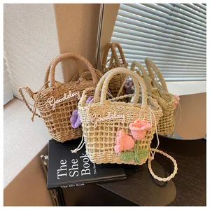 Detailed grid weave of straw bag with crochet tulip floral and drawstring liner
