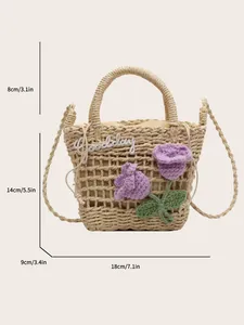 Detail of straw woven bucket bag with 3D purple floral accents and Goodday embroidery