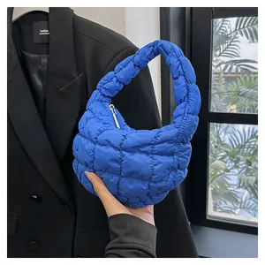 Quilted cloud-style mini handbag in bright blue nylon with a puffy ruched design