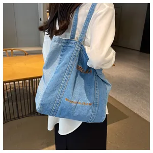 Detailed patchwork denim tote bag with Wisdora Jeans embroidery and sturdy shoulder straps