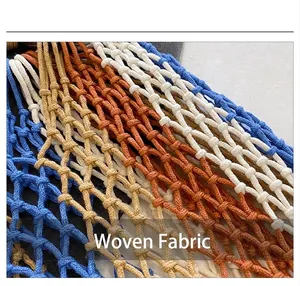 Detailed macro view of bohemian straw bag featuring multi-color woven mesh and fringe