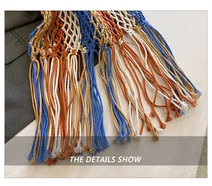 Detail of bohemian handmade woven cotton tassels in blue, beige, and caramel colors