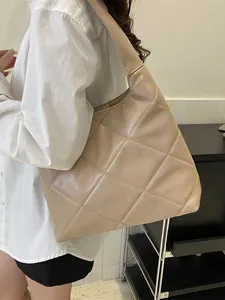 Beige quilted tote bag with large diamond pattern and soft PU leather wide strap
