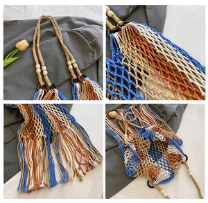 Detail view of woven bohemian beach bag with colorful ropes, beads, and long tassels