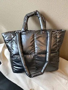 Modern quilted silver puffer tote bag with large capacity and dual handles for commuting