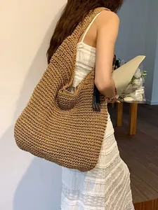 Large capacity straw shoulder bag with woven texture and black tassel for summer travel