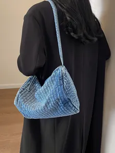 Minimalist blue washed denim large shoulder bag with pleated texture for casual style