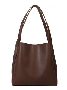 Classic brown leather tote bag with long straps and minimalist structured silhouette