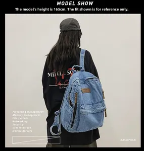 Blue denim backpack shown on a 165cm tall model with a casual vintage wash aesthetic