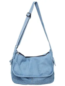 Light blue large denim crossbody messenger bag with adjustable strap and zipper closure
