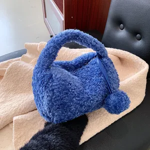 Chic blue plush handbag with fluffy faux fur and round handle for winter fashion