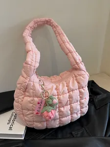 Pink quilted cloud shoulder bag with strawberry charm and fluffy pleated texture