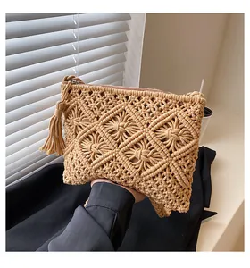 Close-up of woven bohemian bag featuring diamond knit patterns and side tassel detail